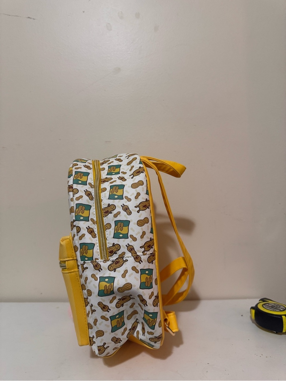 Anya Likes Peanuts Yellow Kids Backpack with Pom Pom Charm - Picture 2 of 11